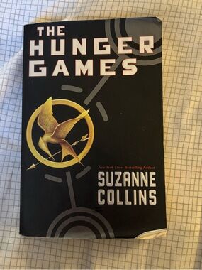 The Hunger Games by Suzanne Collins - Black with Gold Mockingjay Cover
